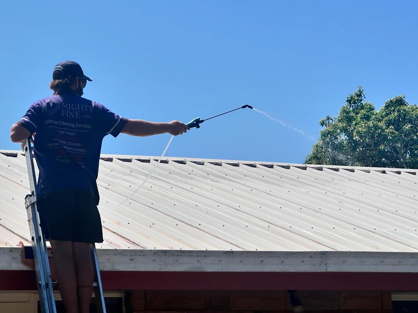 Mighty Fine team cleaning a roof