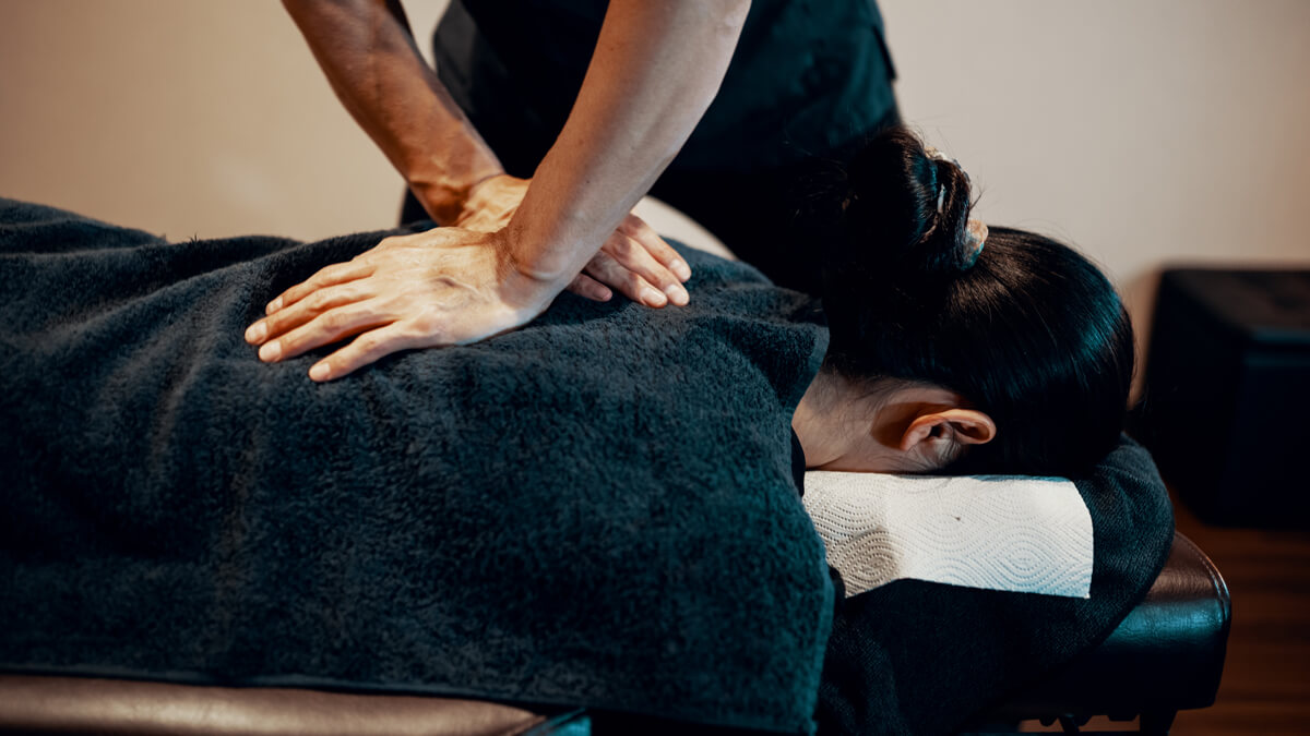 Canberra chiropractor performing a precise manual back adjustment at Weston Creek Chiropractic Centre